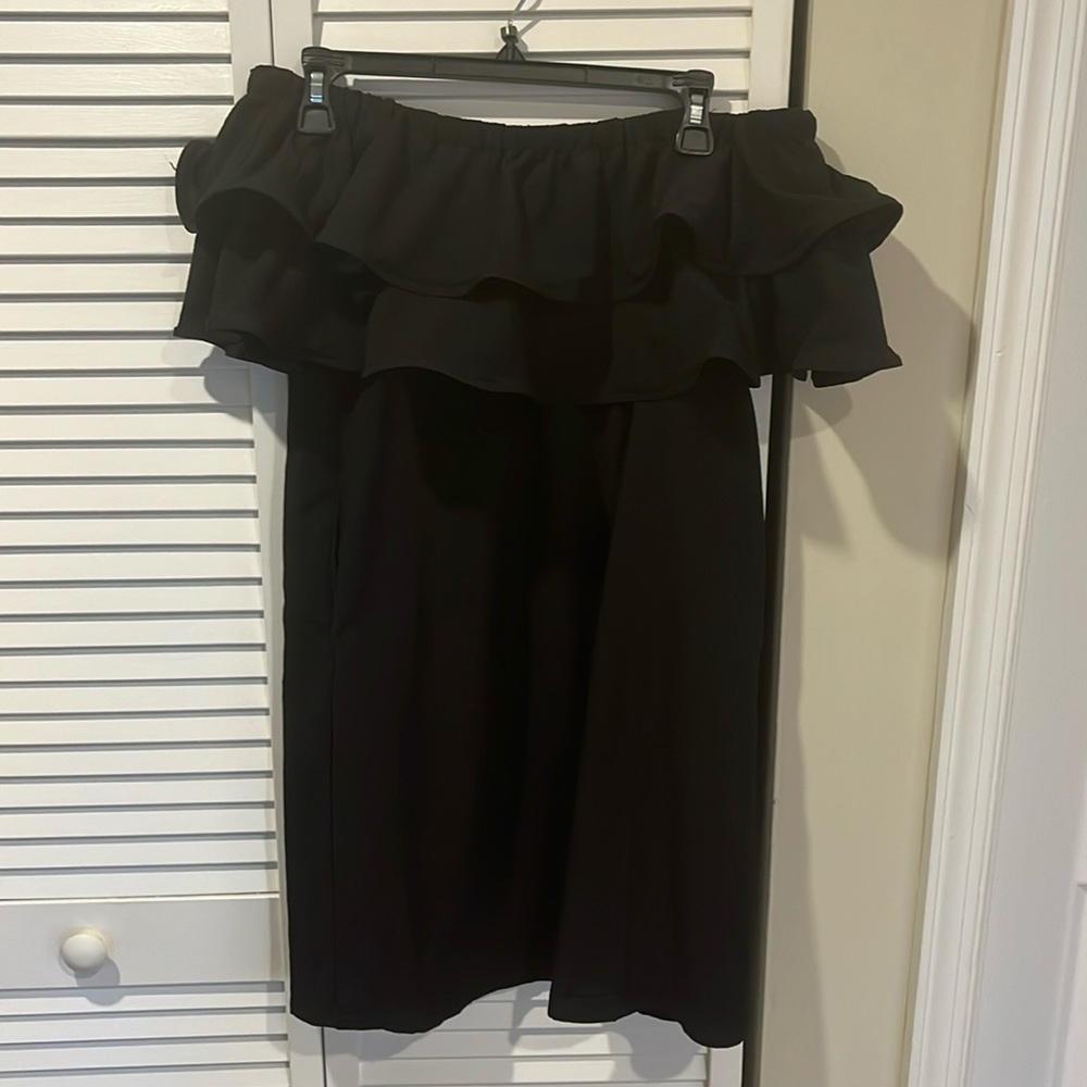 Black off the shoulder minidress. Comes with pockets slightly worn